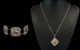 A Middle Eastern Silver Necklace And Bracelet Set Comprising five link bracelet in silver filigree