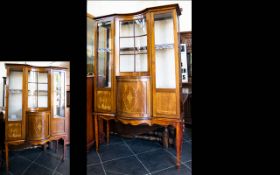 An Edwardian Bow Fronted Display Vitrine Impressive Display Cabinet with central convex cupboard