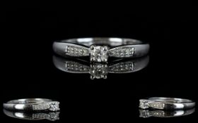 18ct White Gold Diamond Set Dress Ring with Diamond Shoulders. Centre Diamond 0.10 pts.