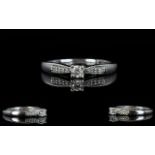 18ct White Gold Diamond Set Dress Ring with Diamond Shoulders. Centre Diamond 0.10 pts.