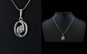 18ct White Gold Diamond Set Pendant Drop with Attached 18ct White Gold Chain. Marked 750.