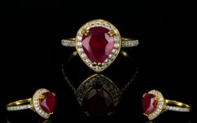 Ruby and Natural White Zircon Ring, a pear cut ruby of 4.25cts framed with .75cts of round cut white