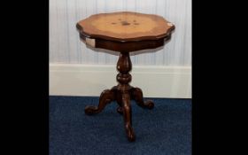 A 20th Century Italian Tripod Table Burr walnut veneer with central inlaid floral posy detail,