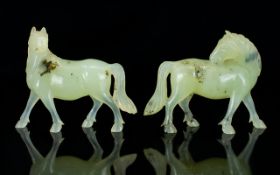 Chinese - Early 20th Century Pair of Hand Carved Natural Celadon Jade Horse Figures.