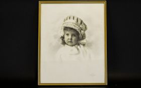 A Vintage Photographic Portrait Of Female Infant Framed and mounted under glass,