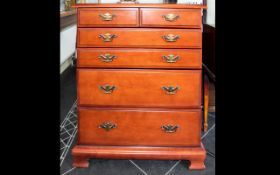 A Chest of Drawers comprising 4 large drawers with two smaller drawers above and decorative brass