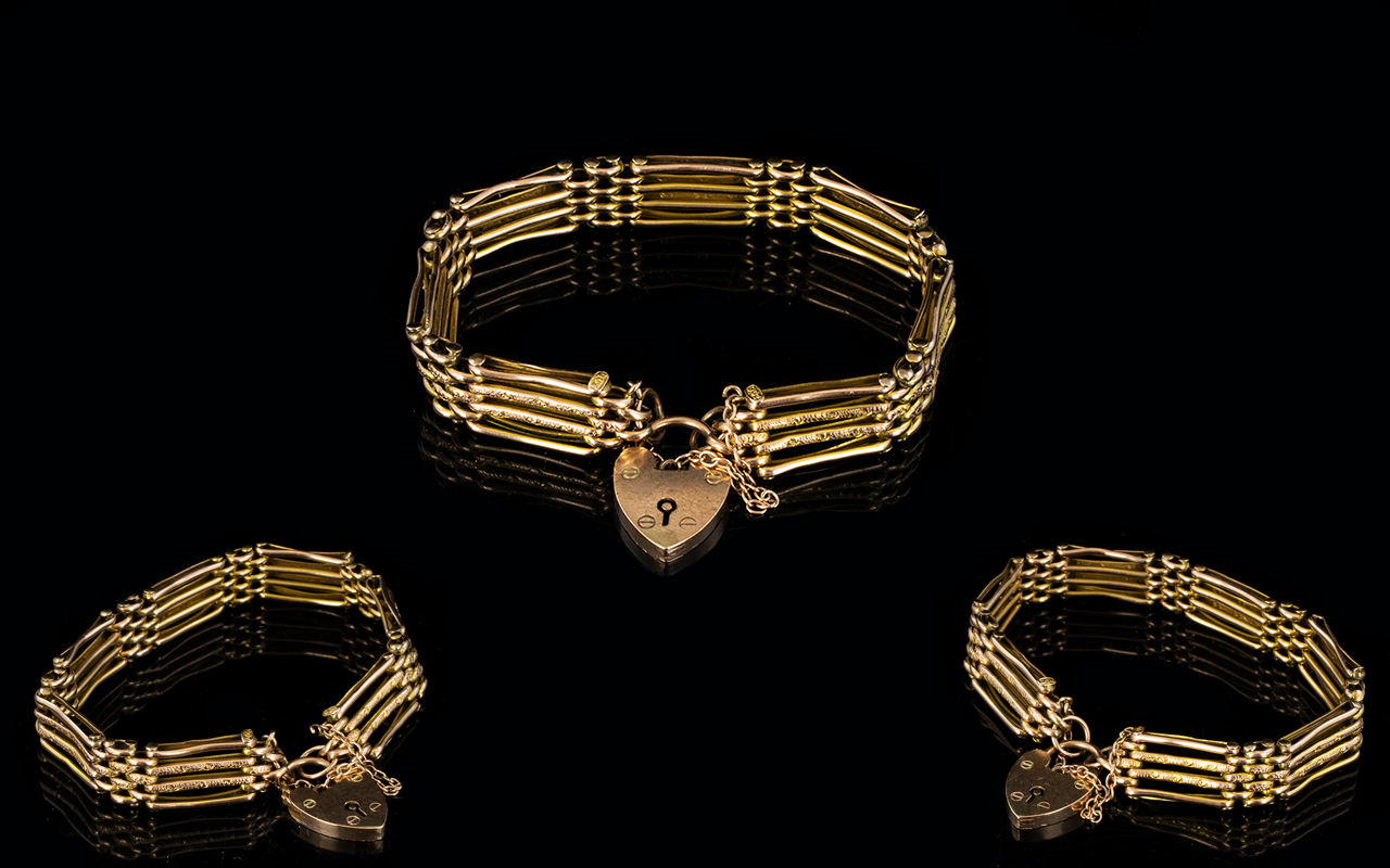 Superb Quality 9ct Gold 4 Bar - Gate Bracelet with Attached 9ct Gold Heart Shaped Padlock.