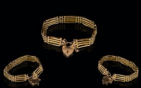 Superb Quality 9ct Gold 4 Bar - Gate Bracelet with Attached 9ct Gold Heart Shaped Padlock.