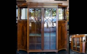 An Edwardian Display Cabinet with impressive glazed sectional doors with two internal shelves,