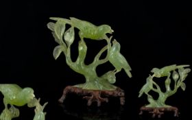 Oriental Carved Jadeite Figure Group In the form of mother bird and fledgling on branches.