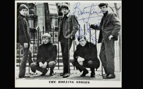 The Rolling Stones Autographs on Brain Jones and Bill Wyman on picture stuck to album page.