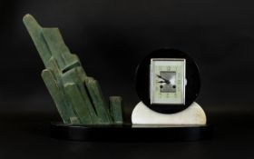 Art Deco Marble And Mixed Metal Mantle Clock Raised on oval black marble base,