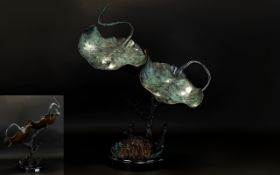 A Large Cold Painted Bronze In The Form Of A Pair Of Stingray Raised on circular black marble base,