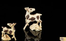 Oriental Carved Ivory Netsuke In the form of a deer,character marks to base, approx 1.