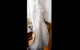 Tulle And Embroidery Detail Wedding Dress A strapless dress with scalloped train and full skirt with