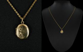 9ct Gold Back and Front Small Oval Shaped Locket with Attached 9ct Gold Chain. Marked 9ct.