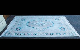 A Large Oriental Rug. With cream cotton fringe and floral lozenge to centre with floral and