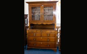 Late 19th Early 20th Century Inlaid Mahogany Bookcase On Chest Features leaded glazed top with two