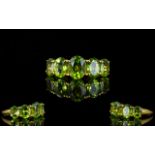 Peridot Five Stone Ring, the five oval c