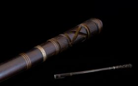 Early 20th Century Small Sword Stick In The Form of a Carved and Polished Hardwood Baton with