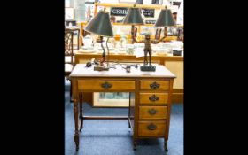 Antique Ladies Writing Desk A kneehole desk with long frieze drawer above four side drawers.