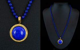 A Stunning Cabouchon Cut Lapis Lazuli Set 9ct Gold Circular Pendant with Attached Matching Lapis