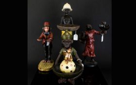 A Collection Of Novelty Oriental Figures Five in total To include mystical monkey candle holder,