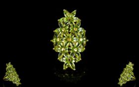 Peridot Floral Lozenge Statement Ring, an elongated cluster of flowers comprising marquise cut