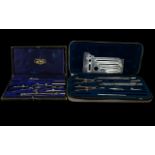 A Draughtmen's Set, one British made, marked J West containing 7 instruments,