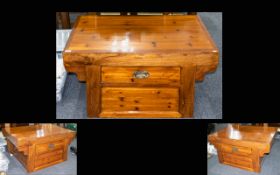 A Varnished Yew Wood Oriental Style Altar Coffee Table Plank top with solid base and single frieze