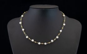 Ladies - Floating Design 14ct Gold Wire and Pearl Necklace. The Pearls with Gold Spacers and Clasp.