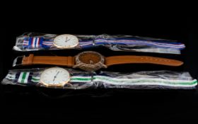 Three Gents Fashion Wrist Watches. Two With Fabric Straps And The Other With Wood Effect.