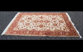 A Very Large Woven Silk Carpet Large Zeigler carpet, beige ground with repeated red and cream floral