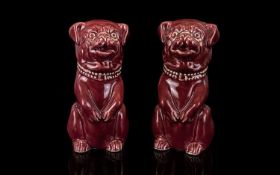 Victorian Period Pair Of Handpainted Ceramic Maroon Pug Dog Figures Fashioned in sitting position,