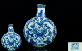 A Modern Reproduction Oriental Moonflask In traditional blue and white decoration,