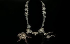 A Collection Of Pewter Tone Vintage Costume Jewellery An unusual collection of three items to