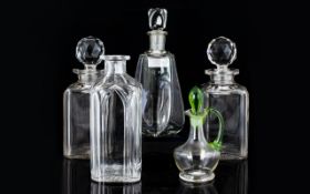 Collection Of Four Decanters And An Oil Pourer.