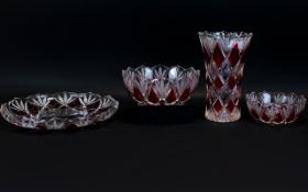 A Collection of Four Decorative Stained Red Glass Crystal Pieces comprising large flower vase,