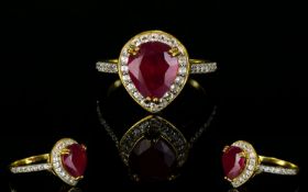 Ruby and Natural White Zircon Ring, a pear cut ruby of 4.25cts framed with .