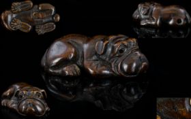 Japanese 19th Century Superb Quality Signed Carved Wood Netsuke of a Bulldog In a Resting Position.