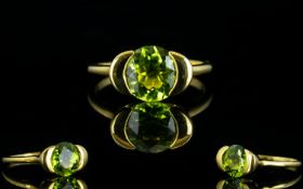 Peridot Semi Bezel Set Solitaire Ring, a round cut 3ct peridot solitaire in a tension style