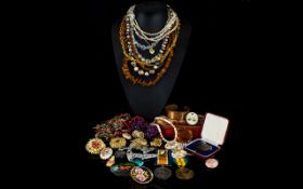 A Mixed Quantity of Costume Jewellery housed in metal tin, to include lucite brooch,