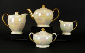 Sadler Four Piece Teaset comprising teapot, two handled sugar bowl, milk jug and water jug.