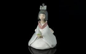 Nao by Lladro Flowers of the Orient 1270 Lady Figurine, She Is In An Sitting Position, Holding a