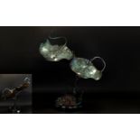 A Large Cold Painted Bronze In The Form Of A Pair Of Stingray Raised on circular black marble base,