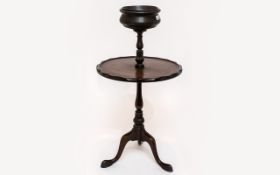 A Victorian Dumbwaiter With Bowl Above Table Top Raised on turned supports with tripod base.