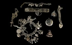 A Vintage Silver Charm Bracelet Loaded with 16 Good Charms. All Marked Silver, 50.
