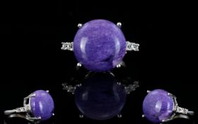Russian Charoite and White Topaz Ring, a round cut of 14.