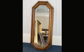 Bevelled Glass Mirror A lozenge shaped mirror in rustic style frame with aged patina. Height, 42