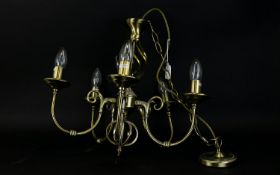 Five Branch Chandelier in a bronzed matt finish.